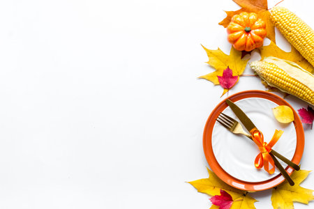 Autumn background with pumpkins, leaves and corn, top view
