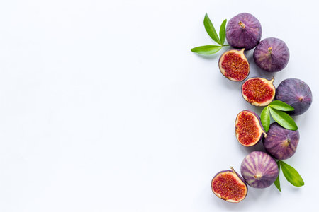 Fresh purple fig fruit with leaves. View from above