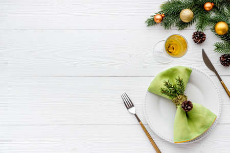 Frame of Christmas table setting with fir tree and empty plate, top viewの写真素材
