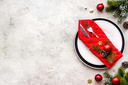 Frame of Christmas table setting with fir tree and empty plate, top viewの写真素材