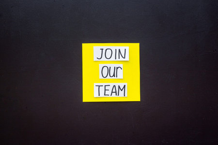 Join our team - recruting concept. Words Join our team on paper banner, top view