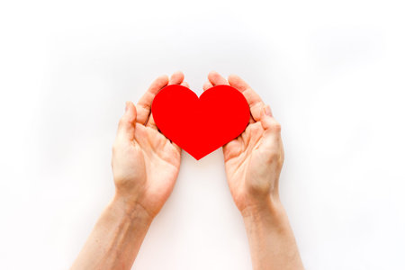 Love concept. Heart made of red paper, top view
