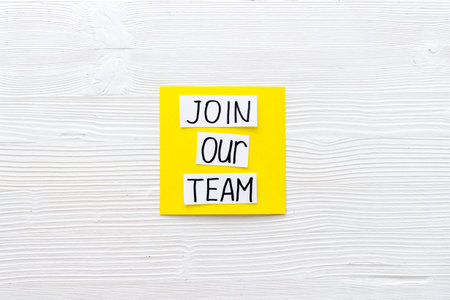 Join our team - recruting concept. Words Join our team on paper banner, top view