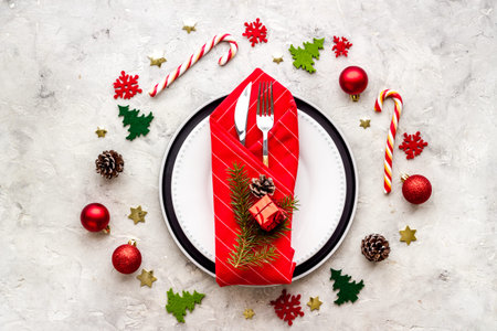 Christmas dinner concept with empty plate and glasses. Top view, flat layの写真素材