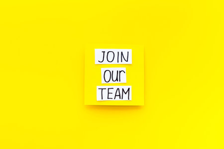 Join our team - recruting concept. Words Join our team on paper banner, top viewの写真素材