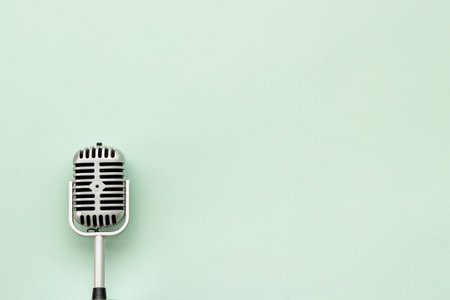 Vintage retro style silver microphone, top view, copy spaceの写真素材