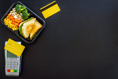 Delivery food is paid with payment terminal and credit cardの写真素材
