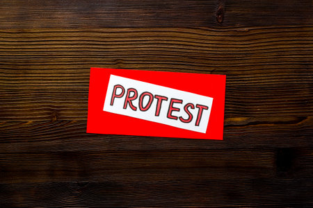 Protest sign concept. Word Protest on paper banner, top viewの写真素材