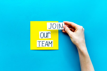 Join our team - recruting concept. Words Join our team on paper banner, top view