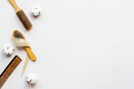 Strand of blond hair wirh hairbrush, flat layの写真素材