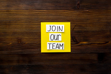Join our team - recruting concept. Words Join our team on paper banner, top viewの写真素材