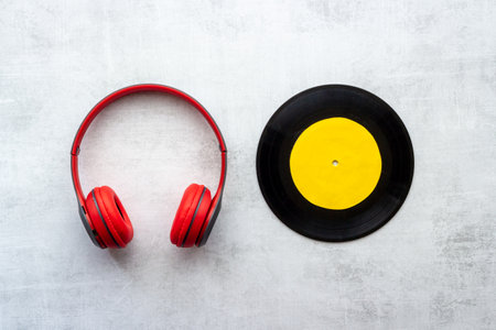 Vinyl record with headphones, music flat design backgroundの写真素材