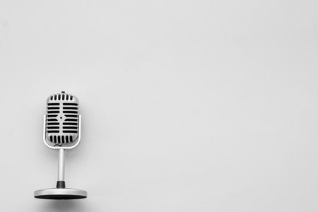 Flat lay of retro classic microphone with space for textの写真素材