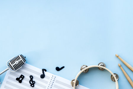 Flat lay of music background - instrument with sheet music, top viewの写真素材
