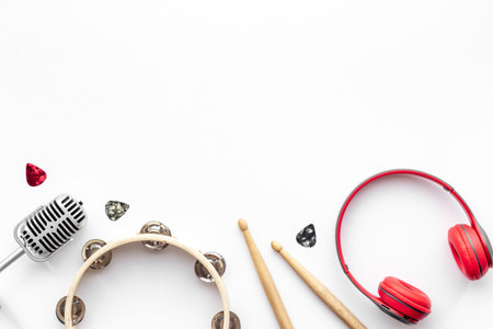 Top view of musical instrument with eadphones, flat design background