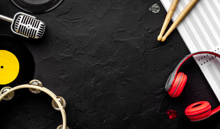 Flat lay of music background - instrument with sheet music, top view