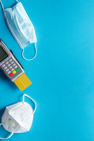 Healthcare insurance concept - payment terminal with a bank card, top viewの写真素材