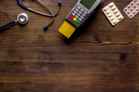 Making medicine purchases - payment terminal with a bank card, top viewの写真素材