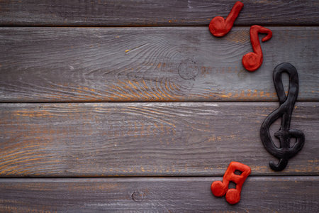 Abstract music notes made of rubber, top view. Music backgroundの写真素材