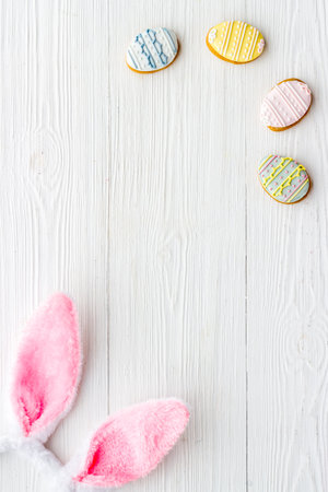 Happy Easter. Bunny ears with colorful eggs cookie, top viewの写真素材