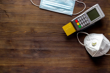 Contactless payment - terminal with medicine face masks, top viewの写真素材