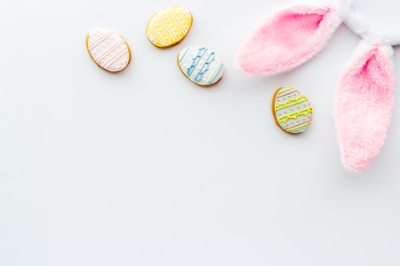 Easter bunny ears with eggs cookies, space for textの写真素材