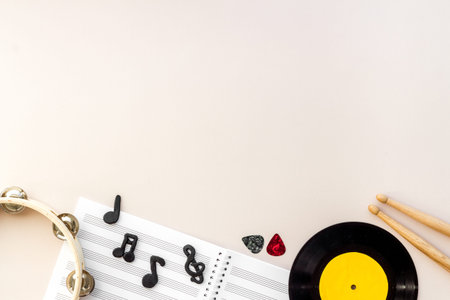 Flat lay of music background - instrument with sheet music, top view
