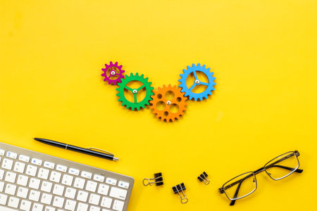 Business process and teamwork concept - working gears on office table, top viewの写真素材