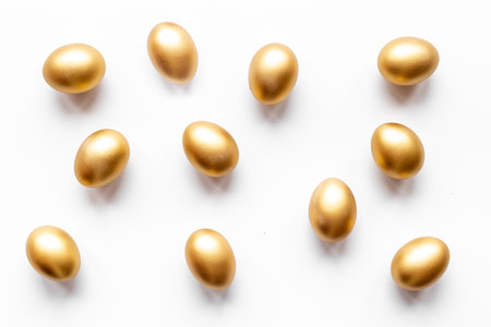 Golden Easter eggs isolated on white background. Top viewの写真素材