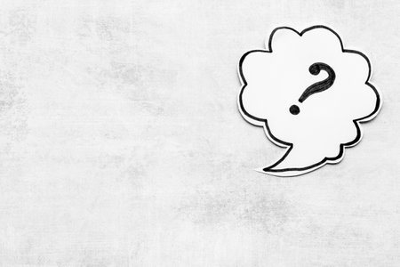 Question mark symbol on speech bubble, top viewの写真素材
