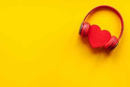 Red headphones with heart shape, top view. Love music conceptの写真素材