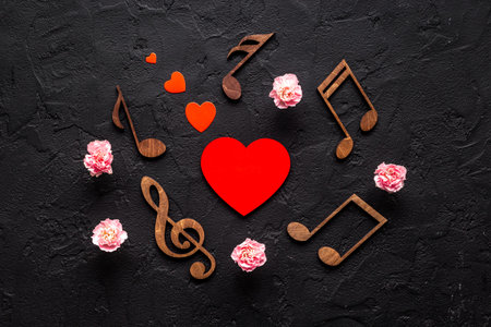 Flat lay of musical notes with flowers. Love songs concept