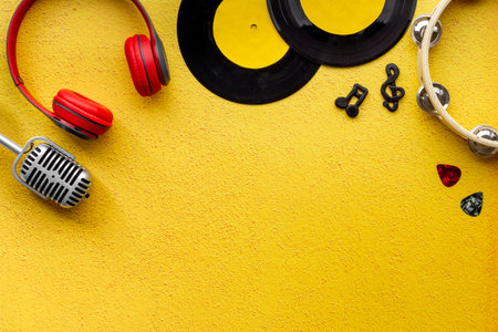 Flat lay musician concept - instrument with vinyl records, top view