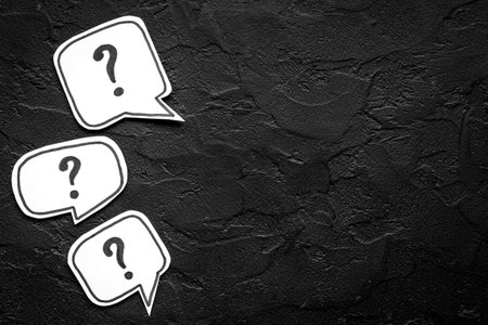 Ask question concept. Question mark on speech bubbles, top view