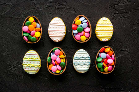Happy Easter flat lay of chocolate eggs and sweets, top viewの写真素材