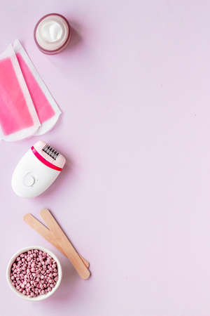 Set for epilation - epilator with wax strips and razor. Top view, flat layの写真素材
