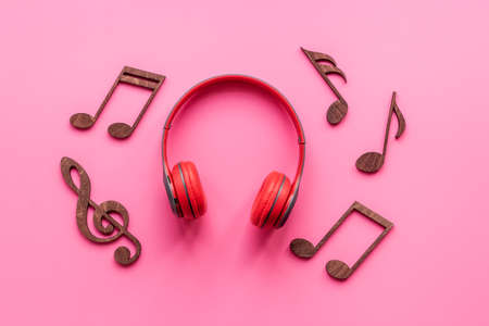 Red headphones with musical notes. Listen to the music conceptの写真素材
