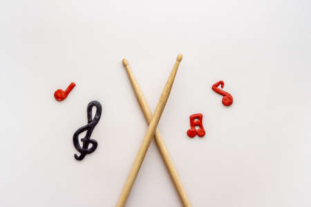 Drum sticks with music notes, overhead view. Music backgroundの写真素材