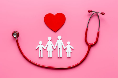 Flat lay with heart, stethoscope and family figure. Medical care conceptの写真素材