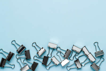 Stationery pattern, office supplies background. Paper binder clips top viewの写真素材