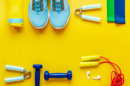 Fitness and gym equipment with sneakers, copy spaceの写真素材