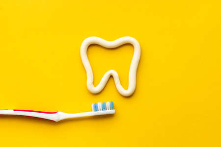 Flat lay of toothbrush with toothpaste, oral care productsの写真素材