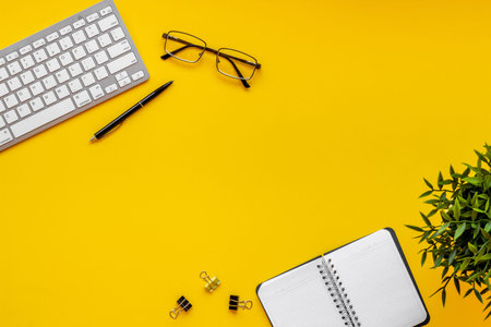 Office table desk flat lay. Workspace with laptop and office supplies