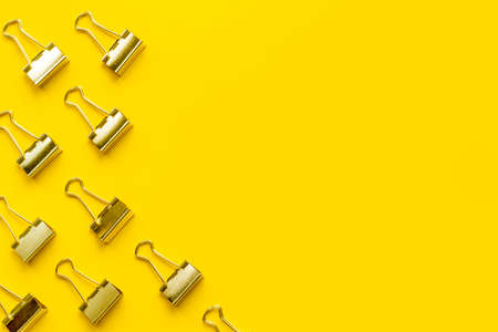 Flat lay of paper binder clips, office supplies patternの写真素材