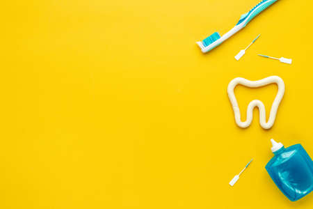 Toothbrush with tube of toothpaste and dental floss. Oral care and dental hygieneの写真素材