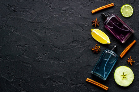 Flat lay of men perfume with flowers and citrus. Top view