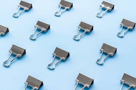 Paper binder clips. Stationery and office supplies background.の写真素材