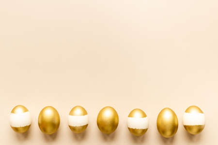 Set of golden eggs with space for text. Easter decoration. Overhead viewの写真素材