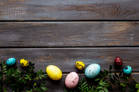 Colorful eggs with green tree. Easter decoration background. Top viewの写真素材
