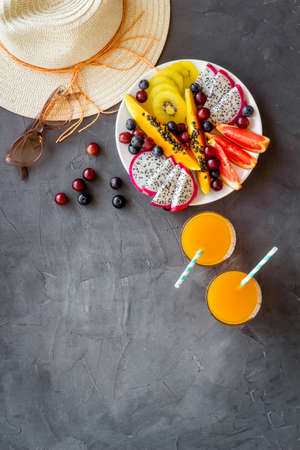 Plate of exotic tropical fruits, top view. Vacation and diet conceptの写真素材